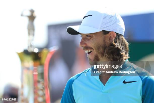 Tommy Fleetwood of England smiles on the 1st tee during the final round of the DP World Tour Championship at Jumeirah Golf Estates on November 19,...