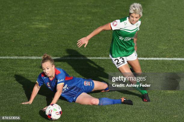 Michelle Heyman of Canberra United contests the ball against Hannah Brewer of the Jets during the round four W-League match between Newcastle and...