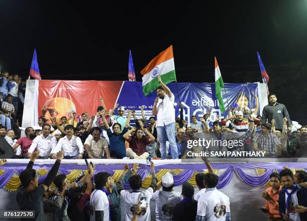 This picture taken on November 18, 2017 shows Hardik Patel , leader of Patidar Anamat Andolan Samiti , addressing a gathering with his supporters...