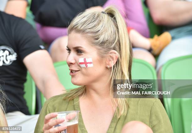 Supporter watches the Rugby League World Cup quarter-final match between England and Papua New Guinea in Melbourne on November 19, 2017. / AFP PHOTO...