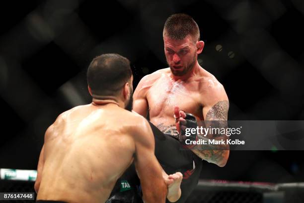 Tim Means of the USA knees Belal Muhammad of the USA in their welterweight bout during the UFC Fight Night at Qudos Bank Arena on November 19, 2017...