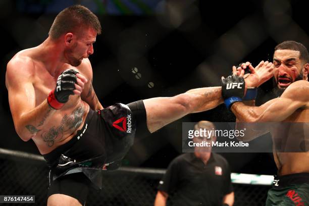 Tim Means of the USA kicks Belal Muhammad of the USA in their welterweight bout during the UFC Fight Night at Qudos Bank Arena on November 19, 2017...