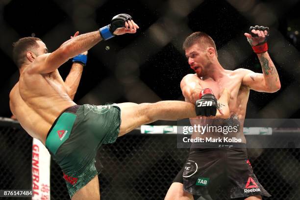 Belal Muhammad of the USA kicks Tim Means of the USA in their welterweight bout during the UFC Fight Night at Qudos Bank Arena on November 19, 2017...