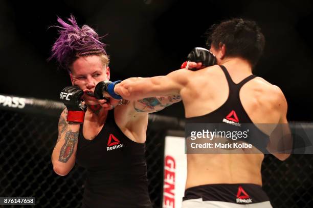 Bec Rawlings of Australia is punched by Jessica-Rose Clark of Australia in their women's flyweightbout during the UFC Fight Night at Qudos Bank Arena...
