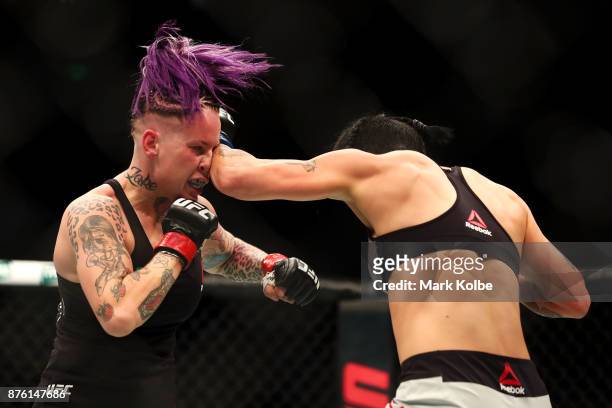 Bec Rawlings of Australia is punched by Jessica-Rose Clark of Australia in their women's flyweightbout during the UFC Fight Night at Qudos Bank Arena...