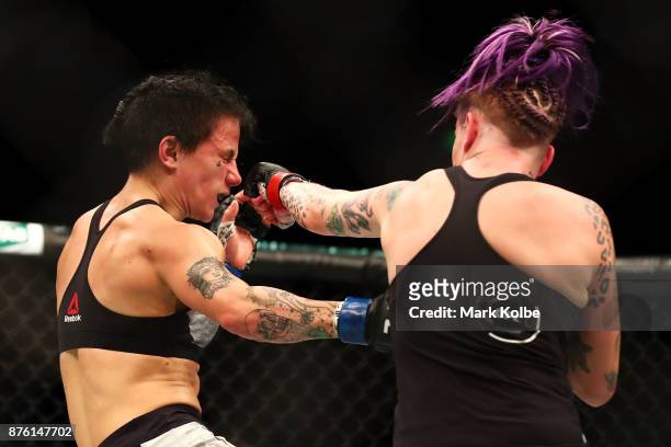 Jessica-Rose Clark of Australia is punched by Bec Rawlings of Australia in their women's flyweightbout during the UFC Fight Night at Qudos Bank Arena...