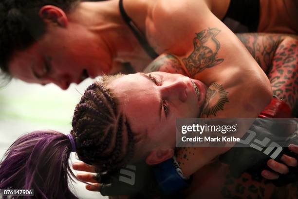 Bec Rawlings of Australia is hedl in a choke holds by Jessica-Rose Clark of Australia in their women's flyweightbout during the UFC Fight Night at...