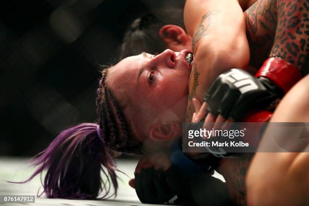 Bec Rawlings of Australia is hedl in a choke holds by Jessica-Rose Clark of Australia in their women's flyweightbout during the UFC Fight Night at...