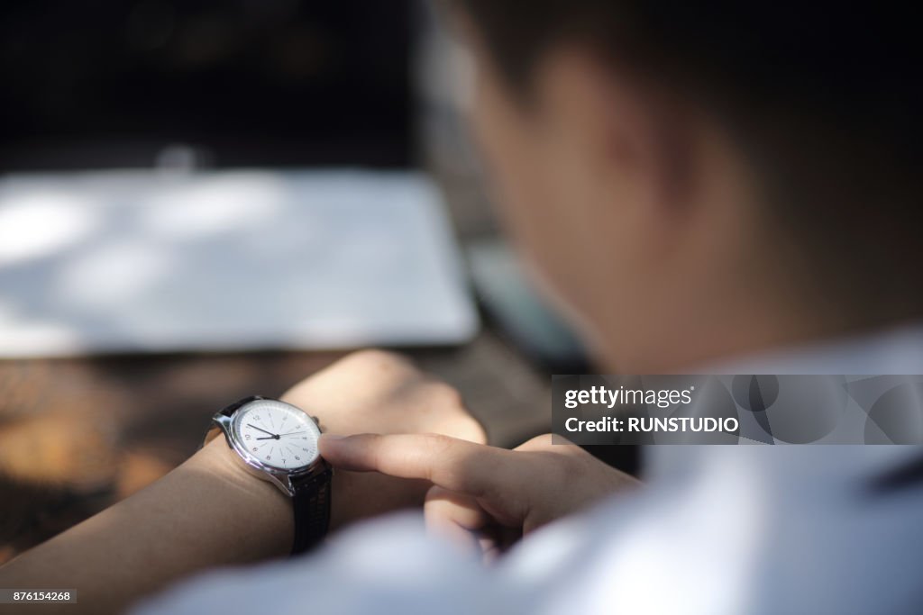 Check Time Watch Businessman Checking The Time On His Watch High-Res Stock Photo - Getty ...