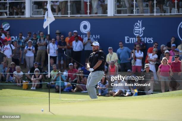 Shane Lowry of Ireland reacts to his third shot on the 18th hole uring the final round of the DP World Tour Championship at Jumeirah Golf Estates on...