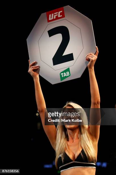 An Octagon girls holds a round two sign during a bout during the UFC Fight Night at Qudos Bank Arena on November 19, 2017 in Sydney, Australia.