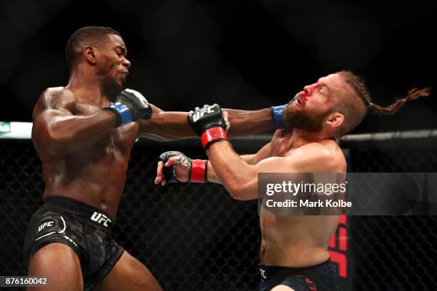 Will Brooks of the USA punches Nik Lentz of the USA in their lightweight bout during the UFC Fight Night at Qudos Bank Arena on November 19, 2017 in...