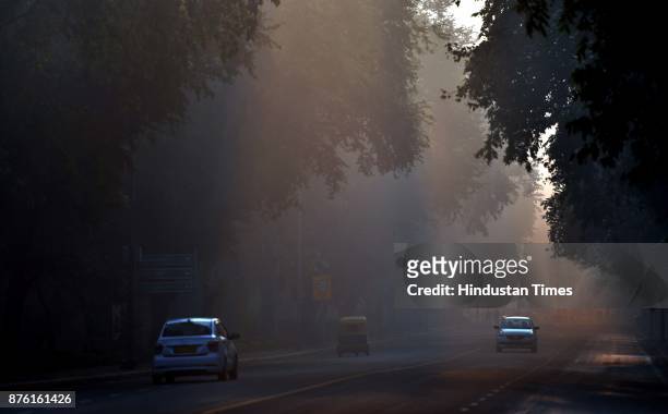 Late night drizzling helped to lower the smog and pollution level in the city, at Crescent road, on November 18, 2017 in New Delhi, India. The air...