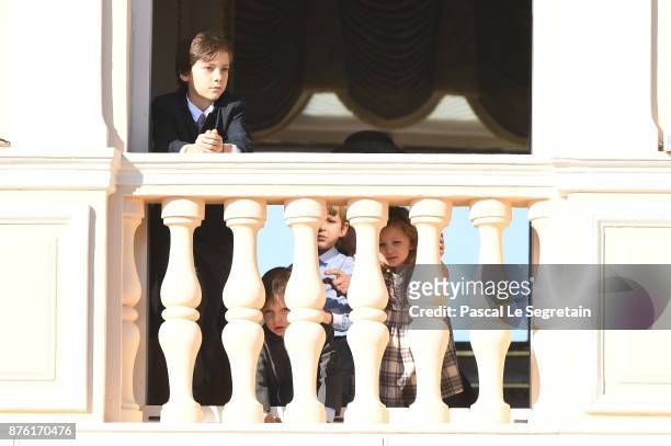 Raphael Casiraghi and India Casiraghi greet the crowd from the palace's balcony during the Monaco National Day Celebrations on November 19, 2017 in...