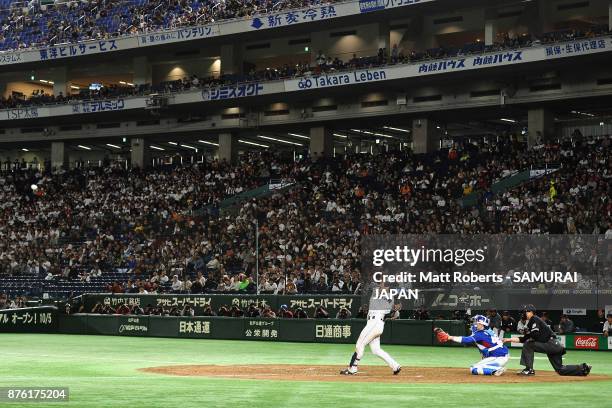 Infielder Shuta Tonosaki of Japan hits a RBI single to make it 2-0 in the bottom of fifth inning during the Eneos Asia Professional Baseball...