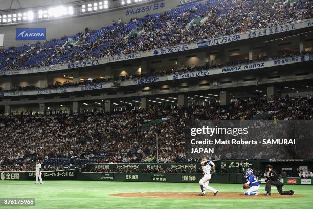 Infielder Shuta Tonosaki of Japan hits a RBI single to make it 2-0 in the bottom of fifth inning during the Eneos Asia Professional Baseball...