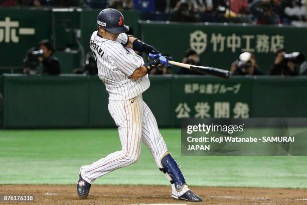 Infielder Shuta Tonosaki of Japan hits a RBI single to make it 2-0 in the bottom of fifth inning during the Eneos Asia Professional Baseball...