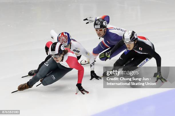 Hwang Dae-Heon of South Korea, Tianyu Han of China and Keith Watanabe of Japan compete in the Men 1000m Quarterfinals during during the Audi ISU...