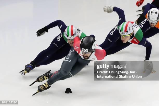 Charles Hamelin of Canada, Tommaso Dotti of Italy and Yuri Confortola of Italy compete in the Men 1000m Quarterfinals during during the Audi ISU...