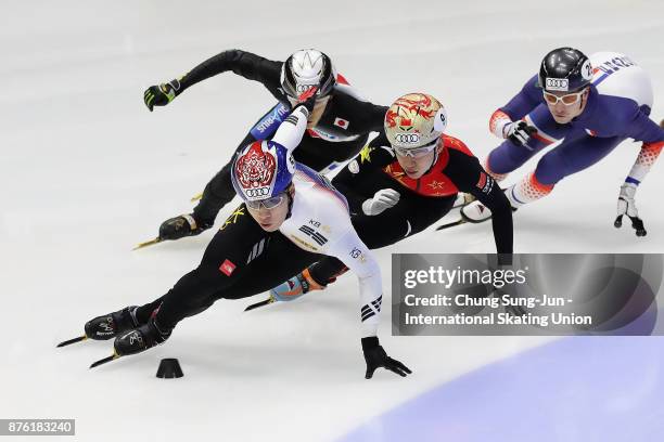 Hwang Dae-Heon of South Korea, Tianyu Han of China and Keith Watanabe of Japan compete in the Men 1000m Quarterfinals during during the Audi ISU...