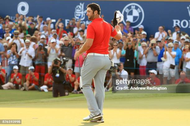 Jon Rahm of Spain acknowledges the crowd on the 18th green during the final round of the DP World Tour Championship at Jumeirah Golf Estates on...