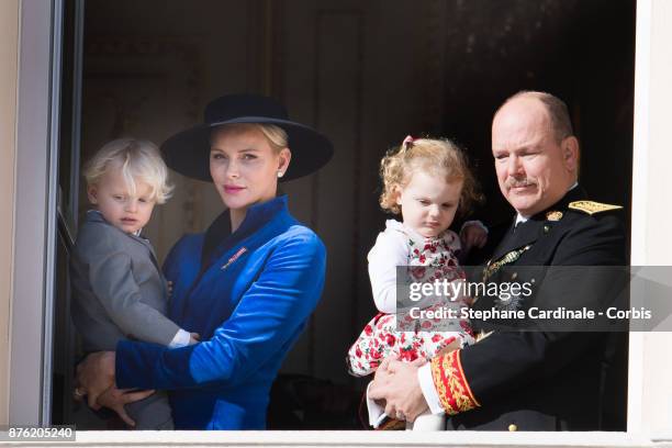 Princess Charlene of Monaco with Prince Jacques of Monaco, Prince Albert II of Monaco with Princess Gabriella of Monaco greet the crowd from the...