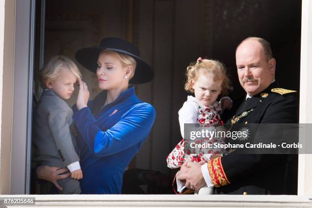 Princess Charlene of Monaco with Prince Jacques of Monaco, Prince Albert II of Monaco with Princess Gabriella of Monaco greet the crowd from the...