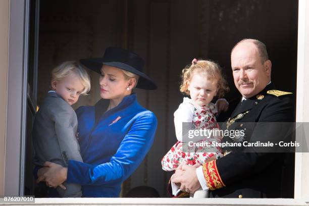 Princess Charlene of Monaco with Prince Jacques of Monaco, Prince Albert II of Monaco with Princess Gabriella of Monaco greet the crowd from the...