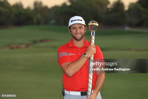 Jon Rahm of Spain poses with the trophy following his victory during the final round of the DP World Tour Championship at Jumeirah Golf Estates on...