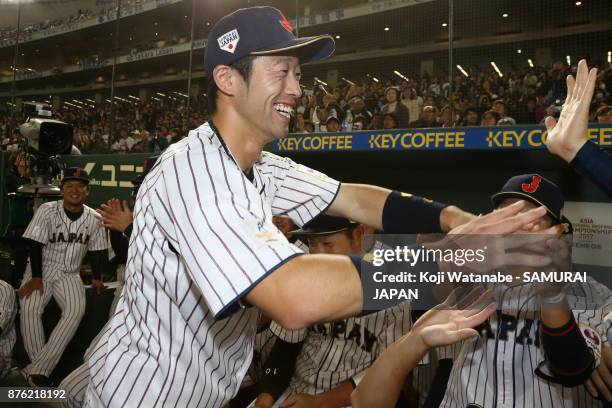 Infielder Shuta Tonosaki of Japan high fives with team mates after awarded the most valuable player after the Eneos Asia Professional Baseball...