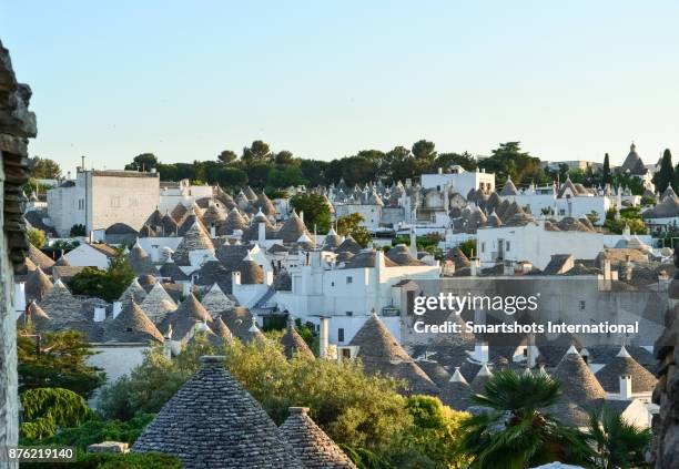 alberobello skyline full of trulli domes in puglia, italy, a unesco heritage site - alberobello stock pictures, royalty-free photos & images