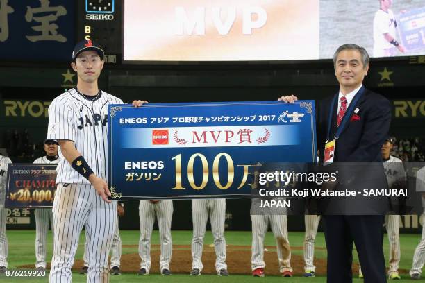 Infielder Shuta Tonosaki of Japan poses for photographs as he is awarded the most valuable player at the award ceremony after the Eneos Asia...