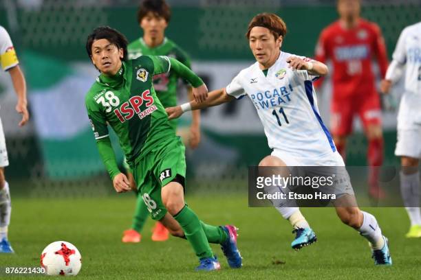 Ryota Kajikawa of Tokyo Verdy and Yatsunori Shimaya of Tokushima Vortis compete for the ball during the J.League J2 match between Tokyo Verdy and...