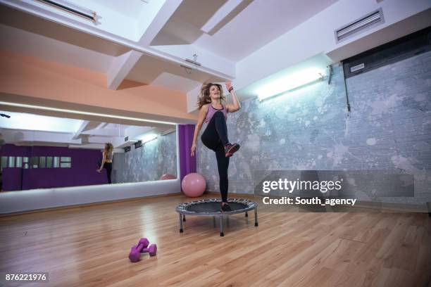 girl training on trampoline - exercise room stock pictures, royalty-free photos & images