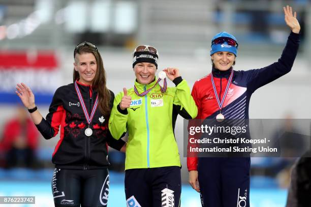 Ivanie Blondin of Canada poses during the medal ceremony after winning the 2nd place, Claudia Pechstein of Germany poses during the medal ceremony...