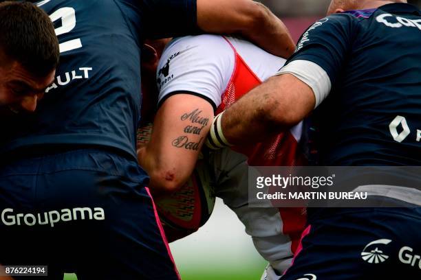 This photo taken on November 19, 2017 at the Jean Bouin stadium in Paris shows the tattoo of an Oyonnox player during the Top 14 rugby union match...