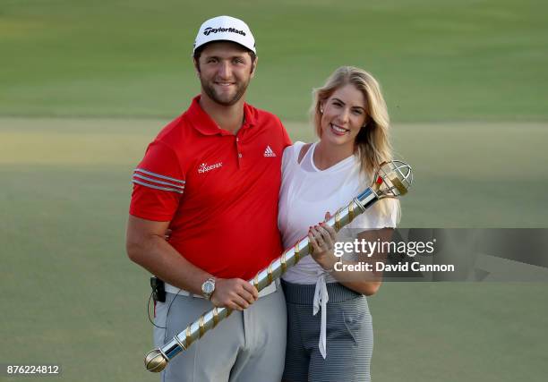 Jon Rahm of Spain holds the DP World Tour Championship trophy with his girlfriend Kelly Cahill after his victory during the final round of the 2017...