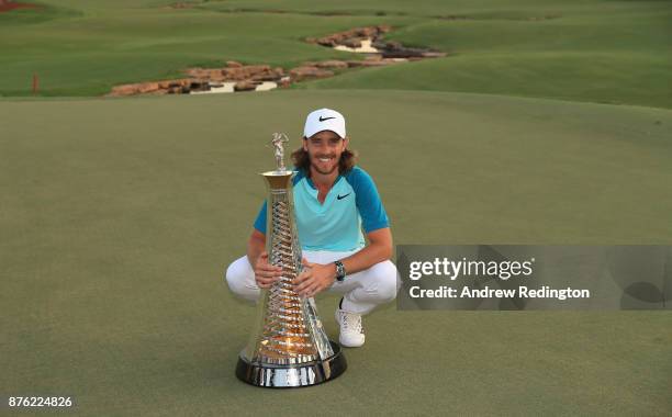 Tommy Fleetwood of England poses with the Race to Dubai trophy after the final round of the DP World Tour Championship at Jumeirah Golf Estates on...