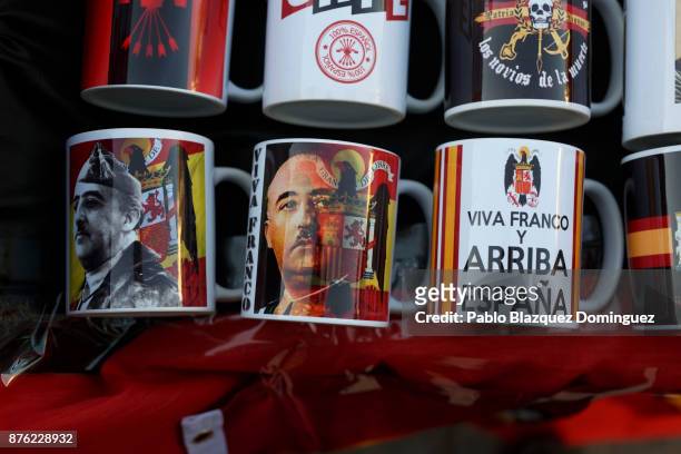 Souvenirs are for sell with the image of Franco and Francoist symbology during a rally commemorating the 42nd anniversary of Spain's former dictator...