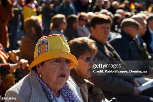 Supporter of Franco wears a hat with a pre-constitutional Spanish flag during a rally commemorating the 42nd anniversary of Spain's former dictator...
