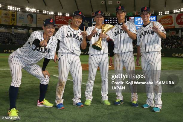 Infielder Yota Kyoda, Catcher Kensuke Kondo, Infielder Ryoma Nishikawa, Outfielder Seiji Uebayashi and Infielder Go Matsumoto of Japan pose with the...