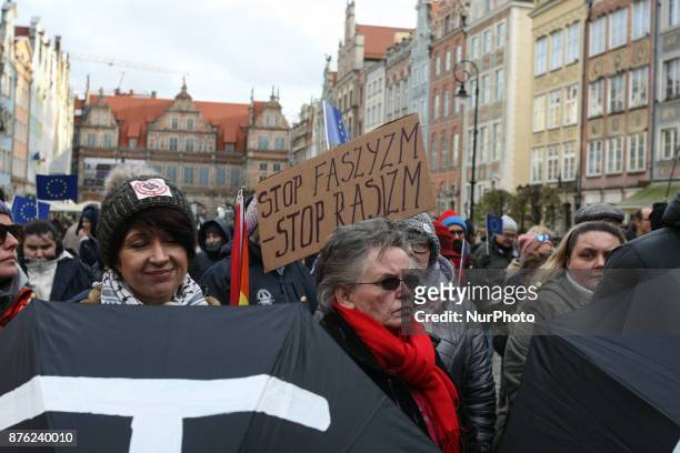 Anti-fascist rally participant with STOP fascism, stop racism banner is seen in Gdansk, Poland on 19 November 2017 People protested against the...
