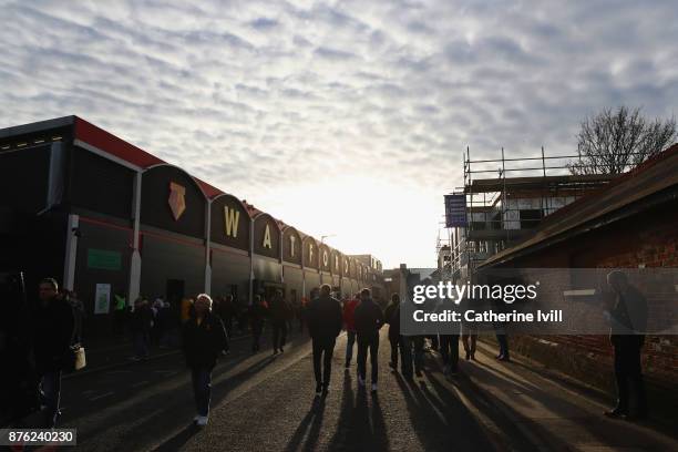 Fans walk outside the stadium prior to the Premier League match between Watford and West Ham United at Vicarage Road on November 19, 2017 in Watford,...