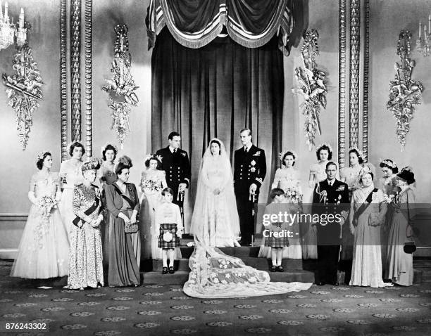 Members of the British Royal family and guests pose around Princess Elizabeth and Philip, Duke of Edinburgh ; at right the group includes Britain's...