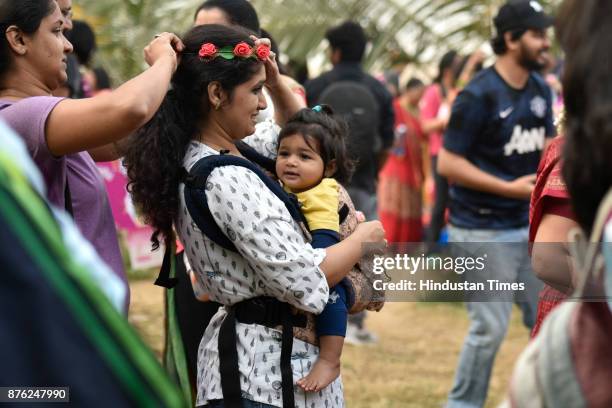 Women with their babies participate in Baby-Wearing Super Moms event organised by by Colors Pinkathon at Juhu Beach, Juhu, on November 18 2017 in...