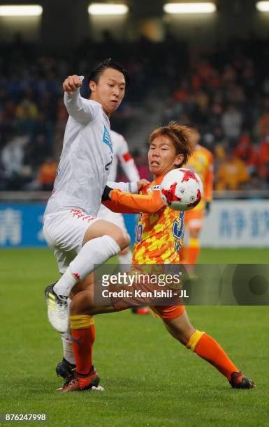 Takuma Arano of Consadole Sapporo and Shota Kaneko of Shimizu S-Pulse compete for the ball during the J.League J1 match between Shimizu S-Pulse and...