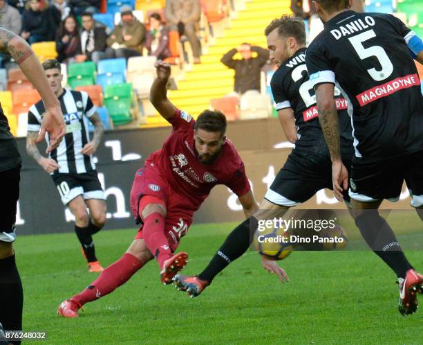 Silvan Widmer of Udinese Calcio competes with Leonardo Pavoletti of Cagliari Calcio during the Serie A match between Udinese Calcio and Cagliari...