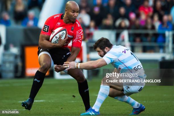 Toulon's South African winger JP Pietersen vies with Racing 92's winger Marc Andreu during the French Top 14 rugby union match RC Toulon vs Racing 92...