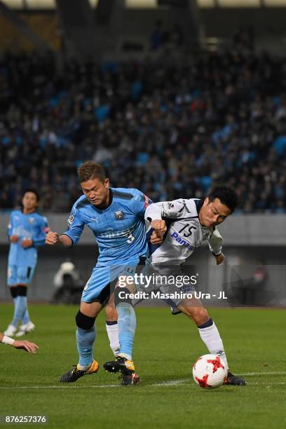 Yasuyuki Konno of Gamba Osaka and Tatsuki Nara of Kawasaki Frontale compete for the ball during the J.League J1 match between Kawasaki Frontale and...