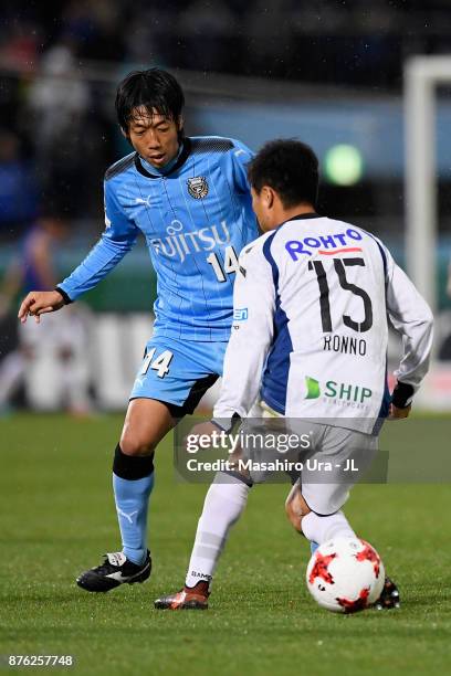 Kengo Nakamura of Kawasaki Frontale takes on Yasuyuki Konno of Gamba Osaka during the J.League J1 match between Kawasaki Frontale and Gamba Osaka at...